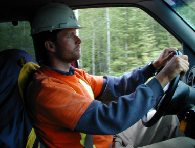 Worker driving pick up truck