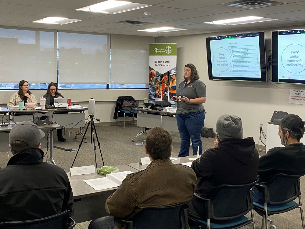 Trainers teaching students in classroom with camera for students online