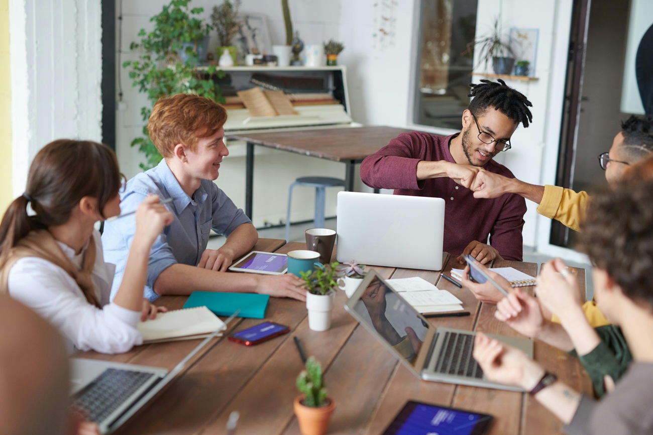 Group of people working together around a table