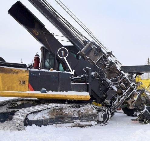 Heavy equipment with hydraulic boom