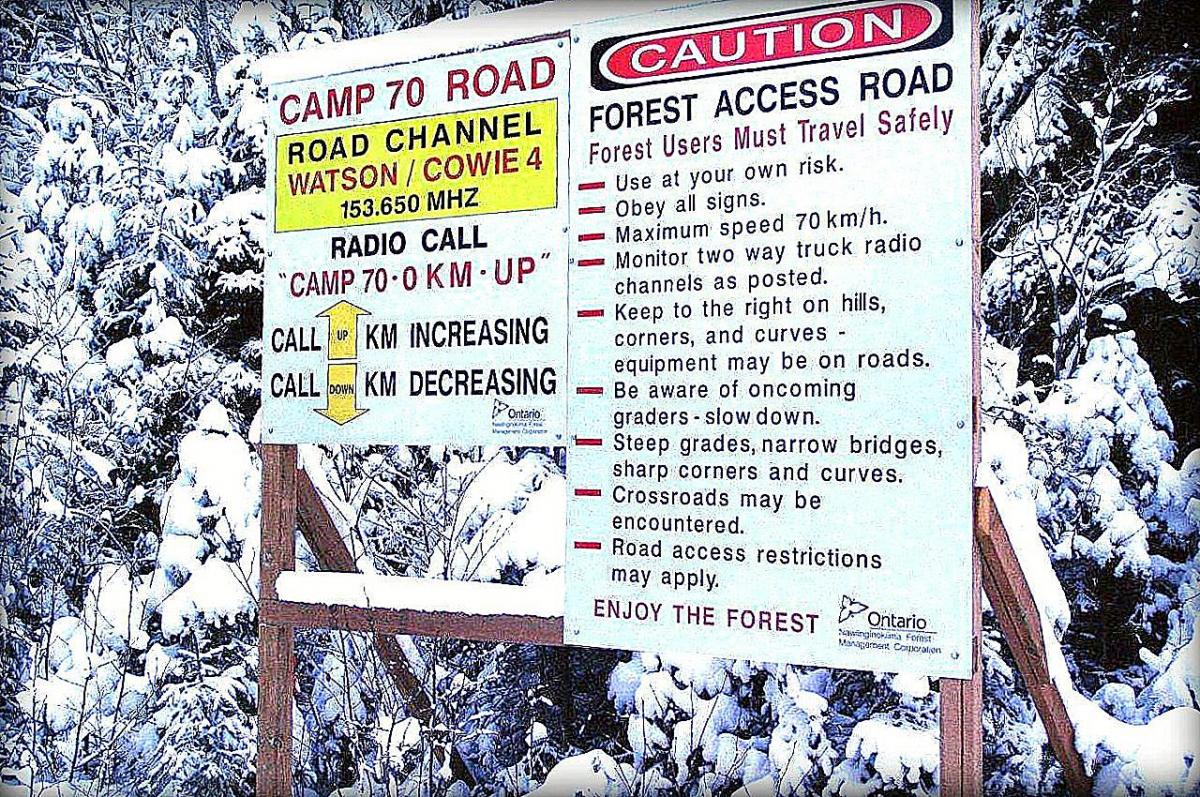 Forest access road signs with radio channel protocol and public warning
