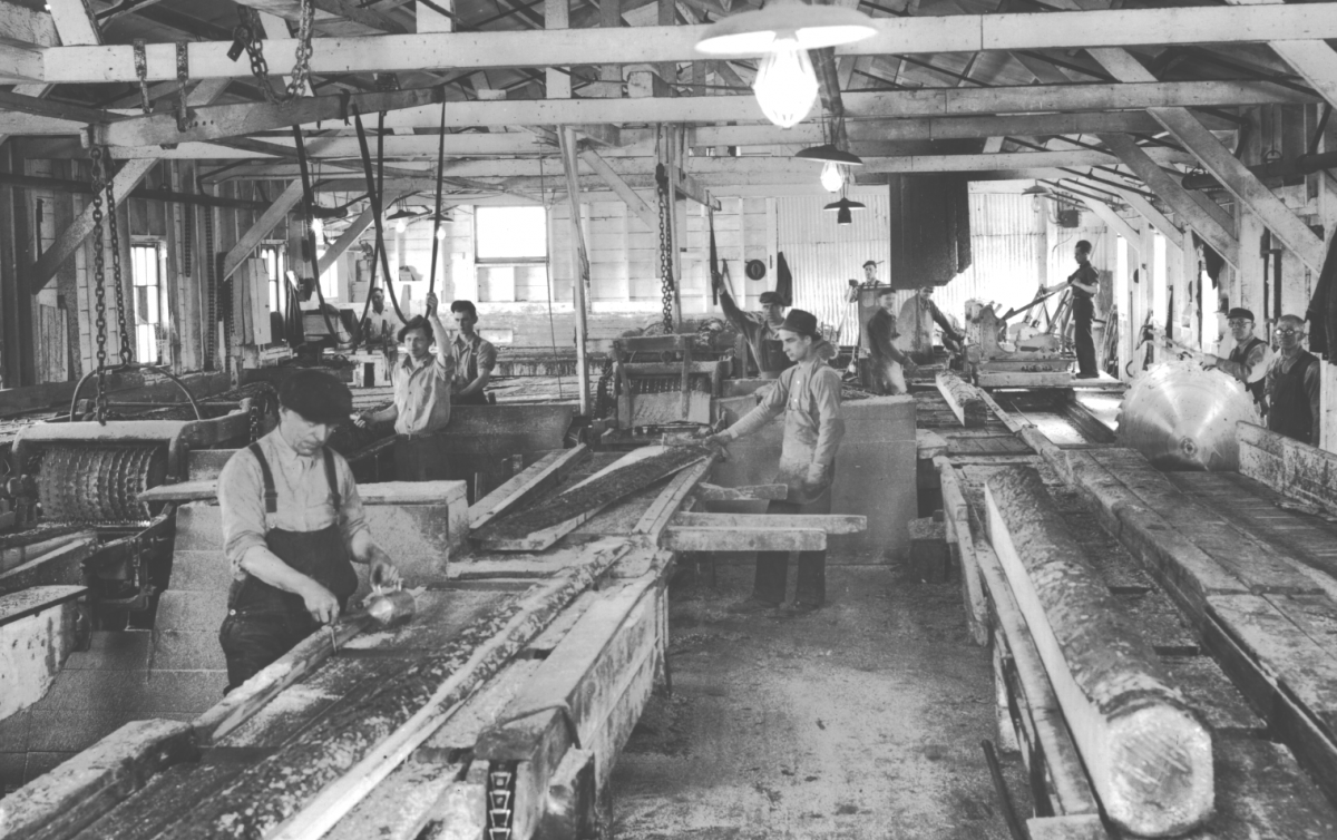 Archival photo of workers in Ontario sawmill