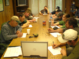 Safety group meeting members sitting around table