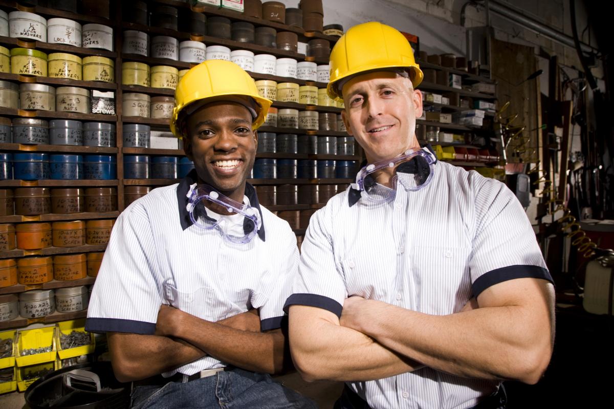 Photo of two workers at a business
