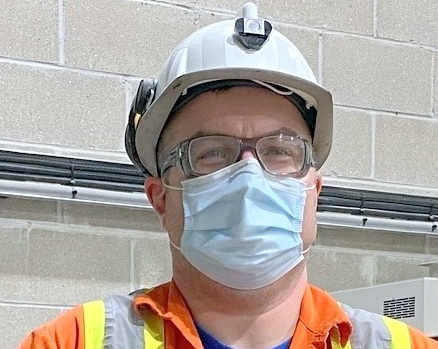 Photo of worker with mask and hardhat, Keith B