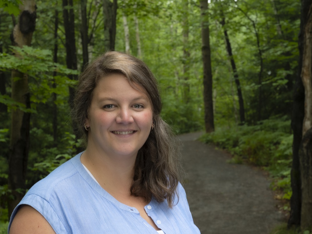 Woman standing in forest