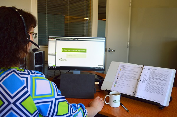 Woman sitting at desktop computer