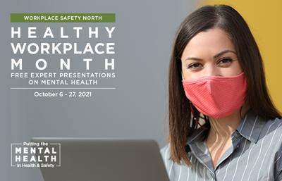 Woman wearing mask and using laptop